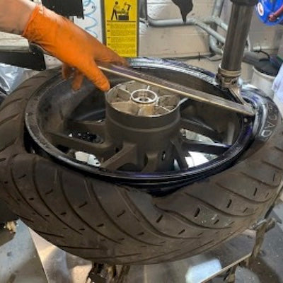 Motorcycle tyre fitting is a skilled job